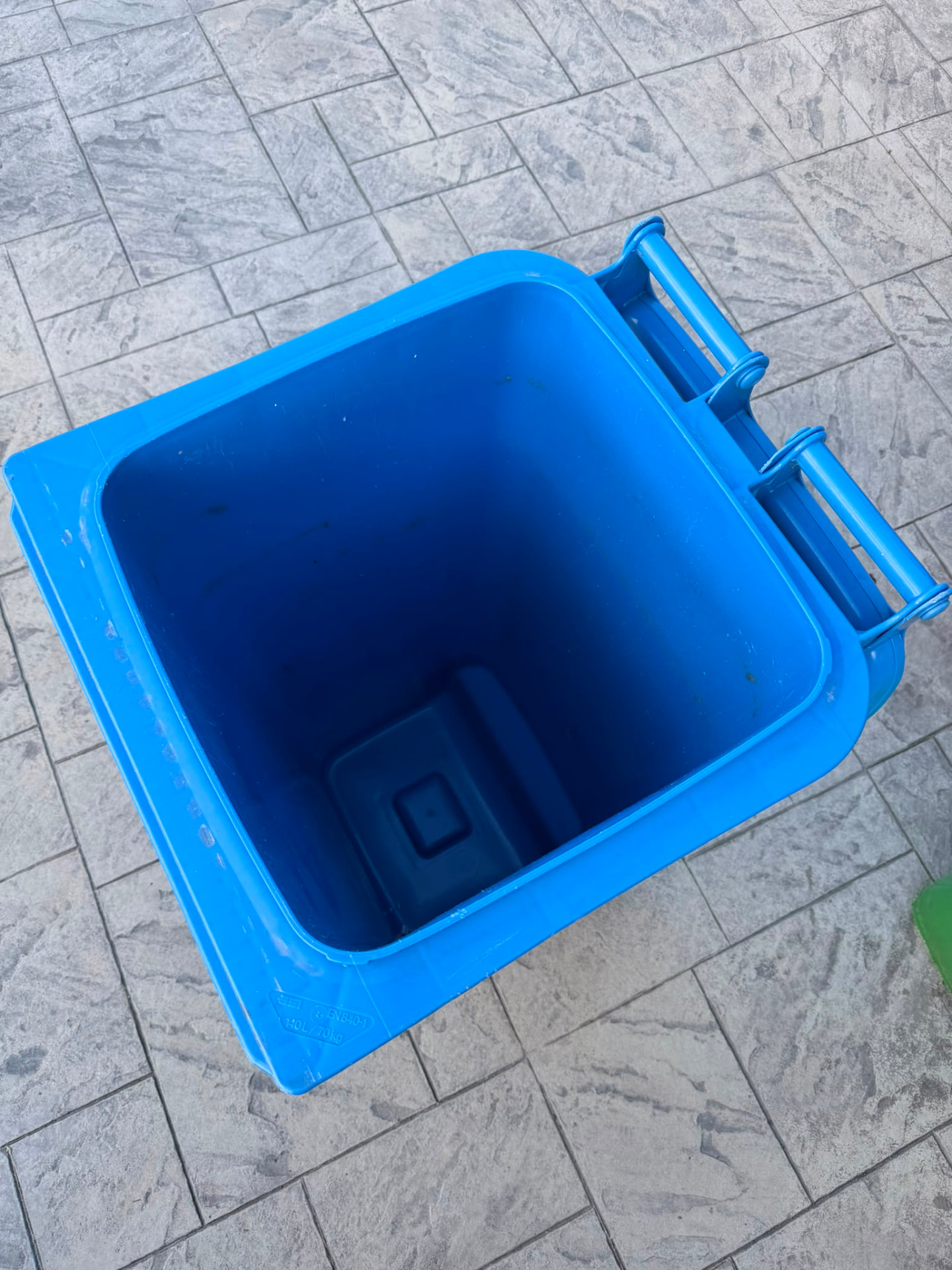 Clean blue wheelie bin after a professional clean