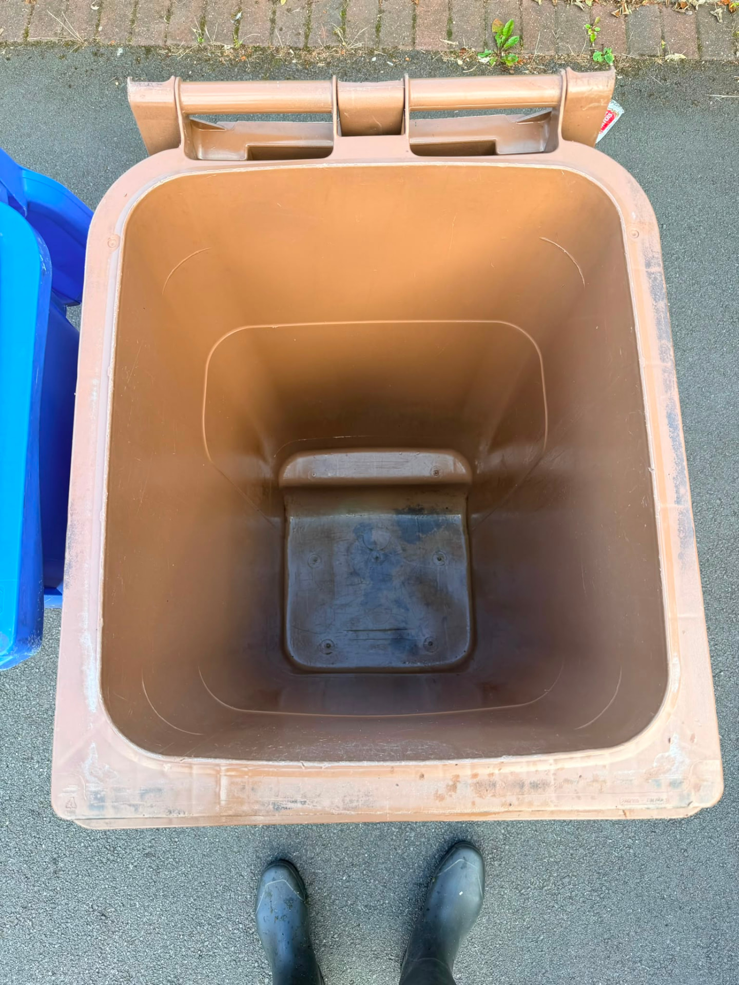 The same brown wheelie bin after professional cleaning, inside clean and fresh