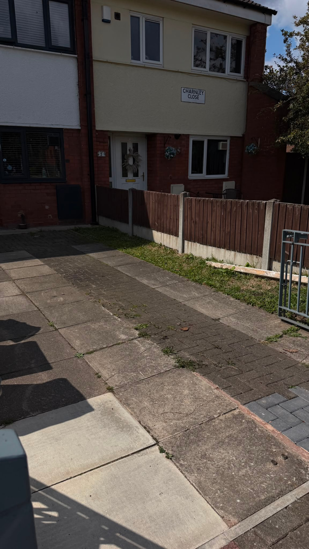 Weathered, mossy paving slabs before pressure cleaning